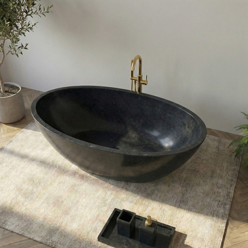 Modern black freestanding bathtub in a minimalistic bathroom with plants and decorative items#color_black